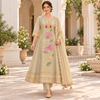 Golden cream embroidered A-line suit for women with pink bird and floral motifs, matching pants and embellished dupatta
