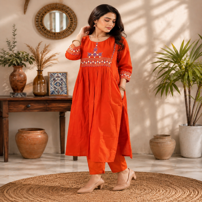 Rust orange A-line cotton kurta set for women with embroidered kurta and straight-fit pants