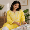 Yellow Chikankari kurta set for women with white floral print and lace palazzo pants