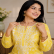 Yellow Chikankari kurta set for women with white floral print and lace palazzo pants
