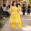 Yellow floral cotton kurta set for women with printed kurta and matching pants