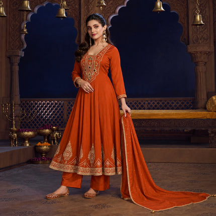 Rust orange royal embroidered Anarkali suit for women with flared kurta, matching wide-leg trousers and coordinating dupatta