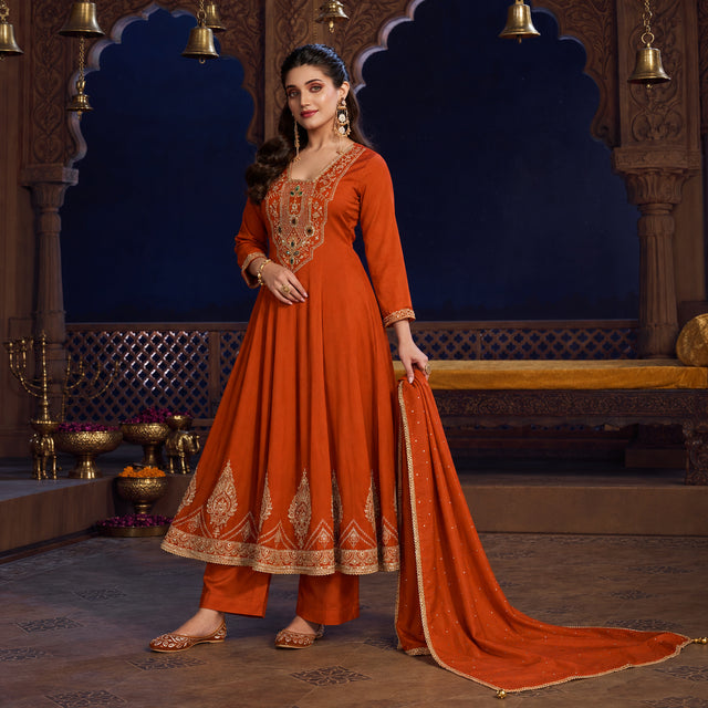 Rust orange royal embroidered Anarkali suit for women with flared kurta, matching wide-leg trousers and coordinating dupatta