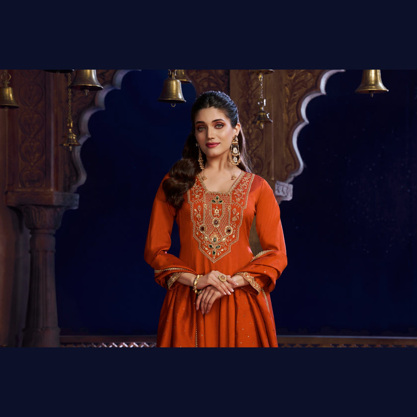 Rust orange royal embroidered Anarkali suit for women with flared kurta, matching wide-leg trousers and coordinating dupatta