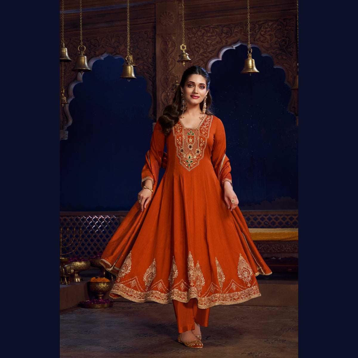 Rust orange royal embroidered Anarkali suit for women with flared kurta, matching wide-leg trousers and coordinating dupatta