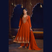 Rust orange royal embroidered Anarkali suit for women with flared kurta, matching wide-leg trousers and coordinating dupatta