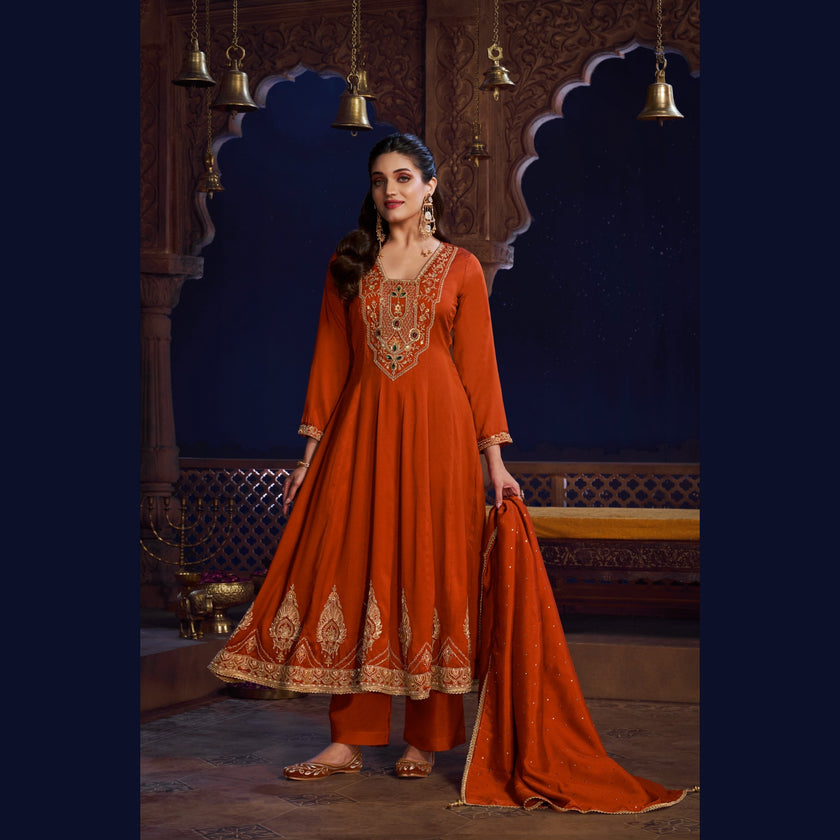 Rust orange royal embroidered Anarkali suit for women with flared kurta, matching wide-leg trousers and coordinating dupatta